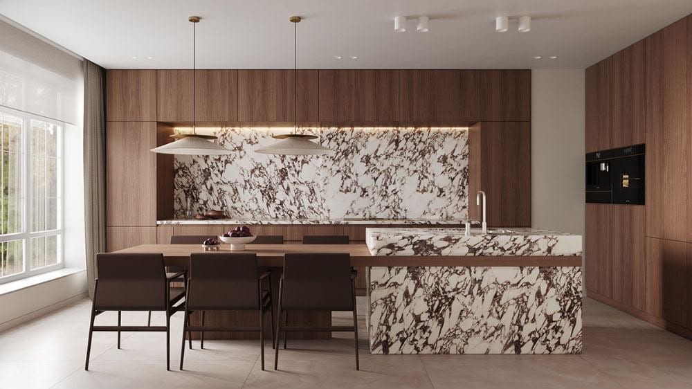 Cocina de diseño con isla de mármol veteado, madera oscura y mesa integrada — showroom A.MODO