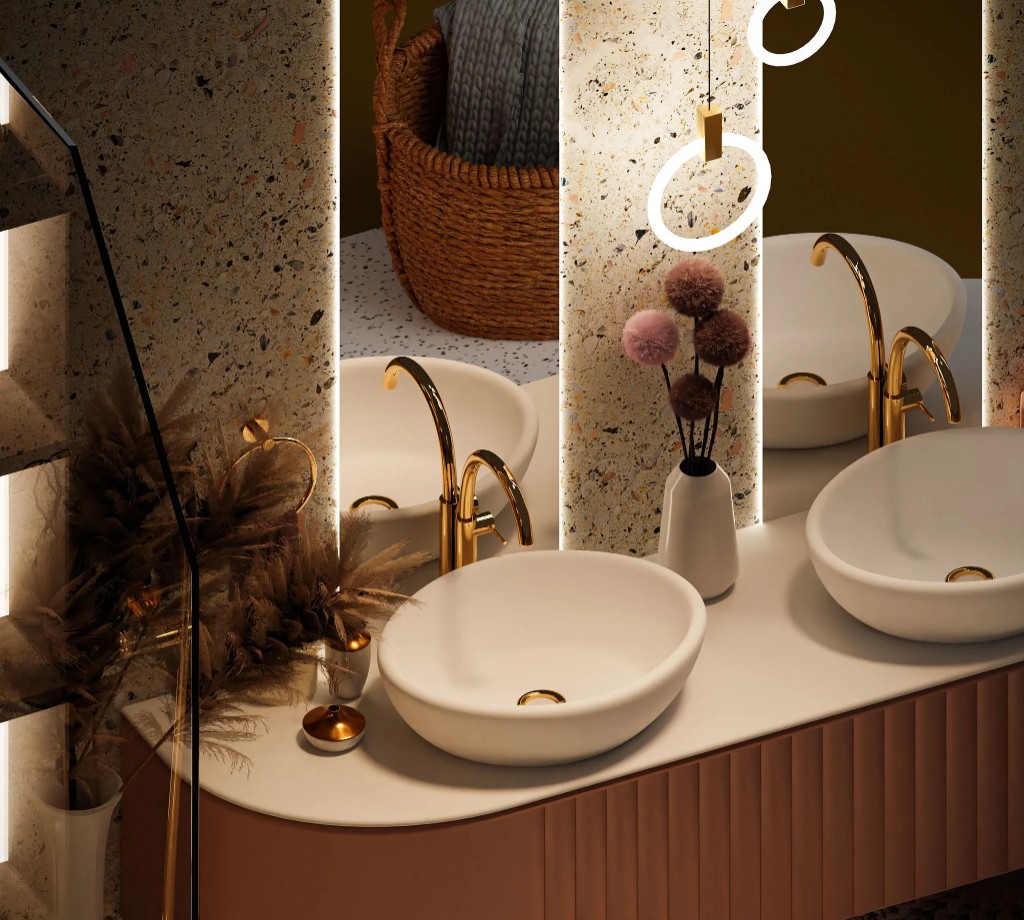 Doble lavabo y grifería dorada